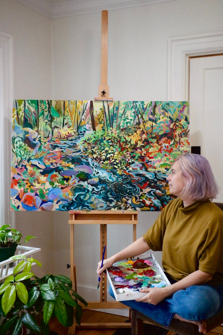 Anisa Asakawa Artist in her studio painting a landscape in the Pacific Northwest